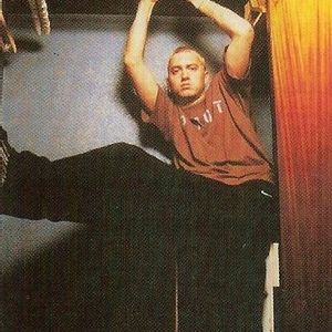 Eminem posing inside of the closet