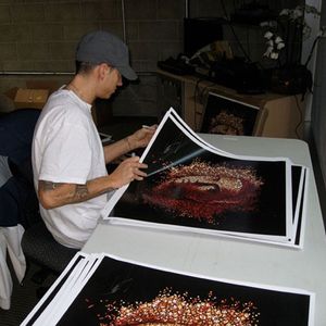 Eminem signing autographs on Relapse posters