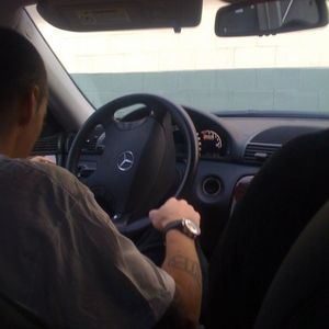 Eminem driving a Merzedes Benz