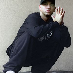 Eminem photoshoot by Gary Friedman 02 Nike Cap and D12 Sweater Holdnig Hands